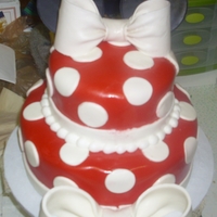 Minnie Mouse Bows were made of gum paste, ears are made of fondant with toothpicks stuck to the back (with gum paste) so they would stay on the cake.