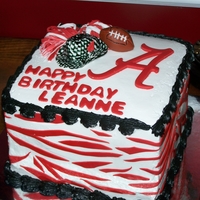 Alabama Football Cake cake is covered in buttercream with fondant accents