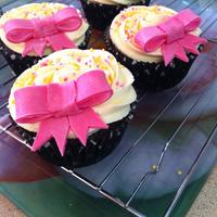 Pink Bow Cupcakes Vanilla Buttercream and Chocolate Cupcake Covered in Pink, White & Yellow Sprinkles and Pink Lustre Dusted Fondant Bows :)!