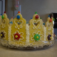 Princess Crown Cake This cake is really easy. You just use a sugar cookie for the actual crown and just arrange them around the cake. You then can use candy to...