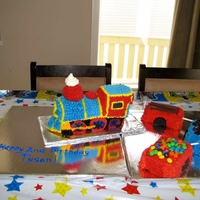 Train Cake This is a train cake I made for my friend's son on his 2nd birthday. I used the Wilton 3D pan and covered the cake in BC using the...