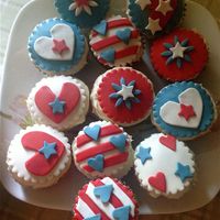 Buttermilk Cupcakes With Raspberries And Blueberries And Cream Cheese Frosting On Top Decorated With Fondant Accents Buttermilk cupcakes with raspberries and blueberries and cream cheese frosting on top. Decorated with fondant accents.