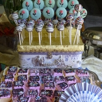 Cake Pops And French Macaron Pops made these for my son's grduatio party sat May 26th. Also made homemade Strawberry marshmallows w/ chocolate and coconut on top.