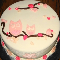 Mom And Baby Owl Cake This is a white cake with strawberry filling, crumb coated with buttercream and covered with marshmallow fondant. Fondant decorations.