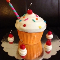 Giant Cupcake With Candle "Funfetti" cake with lemon curd filling, decorated with fondant "Whipped cream and cherry" and a wonky fondant candle...