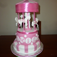 Emily's Baptism Cake Bottom tier white mudcake with white choc ganache, top tier choc mudcake with choc ganache. Fondant icing & horses. Top is made of...