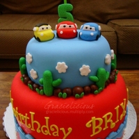Cars Cake 2-layer chocolate fudge cake covered with MMF (6"/9"). All designs were also made from MMF with a little bit of tylose powder.