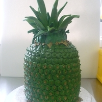 Pineapple yep! A pineapple.This has to be the strangest cake order. all butter cream with fondant leaves.