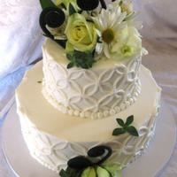 Swirly Cake Small Buttercream Covered Wedding Cake, with Fresh flowers and Black fondant swirls.