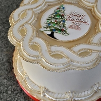 Christmas Cake Royal Icing runout collars, piped border work with piped center medallion. Hand painted gold accents