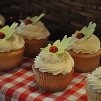 Ladybug Cupcakes ladybug cupcakes with gumpaste leaves and modeled ladybugs atop meringue buttercream.