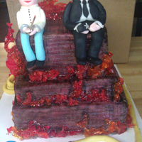 Fire Cake Flames I made this cake for my uncle's award party. The 2 men are made from fondant. One man represents my uncle which he is a State Fire...