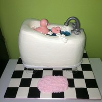 Pink Rubber Duck Shower Cake The ducks are made out of chocolate, the faucet and handles are gumpaste.