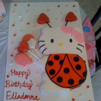 Hello Kitty Birthday Cake This was a valentines day birthday cake! Hello Kitty Love Bug. She is holding cake pops.