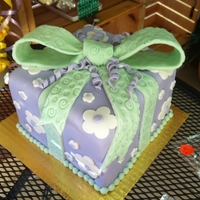 Gift Cake purple wrapped with light green bow square cake
