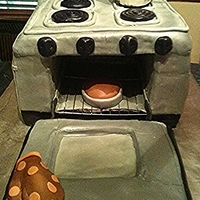 Oven Cake With Tea Kettle And Mini Cake Inside THIS IS AN OVEN CAKE THAT HAS A TEA KETTLE ON THE STOVE TOP, AS WELL AS A MINI CAKE BAKING INSIDE ON THE RACK! IT IS STAINLESS STEEL AND...