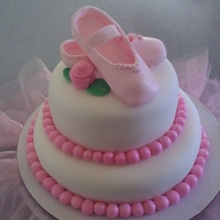 Ballerina Slippers Tiered chocolate cake with chocolate ganache filling covered in fondant. The slippers are gum paste with a little luster dust. I added the...
