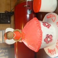 Giant Cupcake Fairy i made white modeling chocolate and created the fairy, and used a giant cupcake (bc frosting)