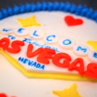 Las Vegas Cake Vanilla birthday cake with vanilla buttercream and fondant decorations.