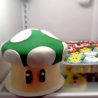 Super Mario Mushroom Cake And Cupcakes Super Mario themed kids birthday cake and cupcakes.