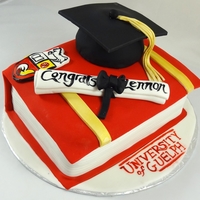 Guelph Graduation Cake Textbook with University Crest, diploma, and Graduation hat