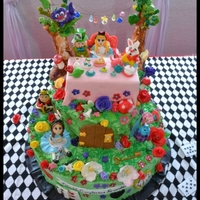 Alice In Wonderland Alice in wonderland cake i made for my niece, all the characters are fondant :)