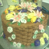 Basket Cake I'm in a beginning cake decorating class at OCC, and we just finished our basket cake. First time ever making Royal Icing flowers!