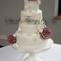 Sugar Roses And Piping Replication of the jewels on the brides dress and the flowers in her bouquet