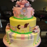 Baby Girl Horse Cake All buttercream civered teirs with fondant accents.Hand piped the horse that matches the bedding. Everything was made to match the baby...