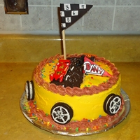 Butter Cream Cake cars cake for birthday boy it is a 8" round chocolate strawberry filling and banana flavored frosting wheel made out of oreos.