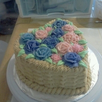 Heart Basket Full Of Flowers This is my cake I made trying out the Basket Weave I'd just learned. 2 layers, a strawberry and a lemon, with a rasberry filling, and...