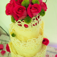 White Chocolate Wedding Cake White chocolate wrap wedding cake with filigree top edges. Client requested a small cake. 20cm Rich chocolate bottom tier, 15cm middle...