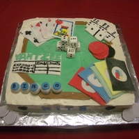 Game Cake We have a Tues nite game group so we filled the cake with reminders of our games, bingo, dice, yahtzee, uno and card games.