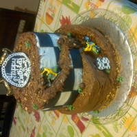 Dirt Bike choc cake top tier white cake bottom tier all homemade icing with grahamcracker and choco cake crumbles for drit and gravel look and black...