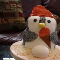 Penguin Baby Shower A baby shower cake for my sister in law. Lady finger cake layered with Passionfruit buttercream and covered in fondant.