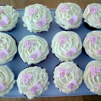 Red Velvet Cupcakes Red velvet cupcakes with cream cheese frosting and pink fondant decorations