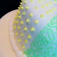 Wedding Cake Rolled fondant wedding cake with cornelli lace and dot decorations.