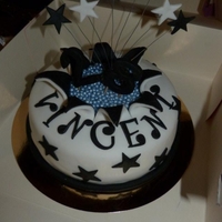 Exploding Star Cake One of my first fondant cakes. I made this cake for my fiances friend. It is chocolate sponge with 3 layers of chocolate ganache.