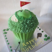 Giant Golf Themed Cupcake! I made this for a 25th birthday. Despite appearances it was actually lemon flavour with lemon filling! The recipient of the cake plays Golf...