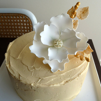 Elegant Baby Shower I wanted to make a cake as elegant as the mum to be. I have long wanted to make a white flower with gold detailing so here it is. It is...