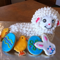 Lamb Cake Made From Wilton Mold Pound Cake With Vanilla Buttercream Cookies Purchased From A Different Bakery Lamb Cake made from Wilton mold. Pound cake with vanilla buttercream. (Cookies purchased from a different bakery)