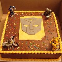 Transformer Cake Chocolate cake with chocolate icing birthday cake for a 5 year old. The mask is fondant.