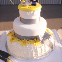 A Lady, Her Sunflowers, And Her Marine Most important wedding cake I've done ....my daughter's! :-) Bottom tier ruffled SMBC topped with fondant sunflowers, mid tier...