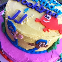 Bubble Guppies top tier is a 2 layer limeade cake, bottom tier is strawberry cake, covered in all vanilla buttercream with fondant decorations
