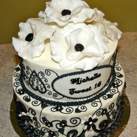 B&w Sweet 16 Cake Two tier, red velvet cake, filled with vanilla filling and covered in buttercream.