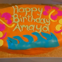 Surfboard Cake My first marshmallow fondant covered cake.Hawiian themed cake. Half of the cake is chocolate, the other half strawberry.