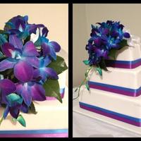 Three Tier Square Wedding Cake Three tiered square chocolate mud cake with fresh Singapore orchids