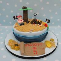 Pirate Cake 9" Vanilla cake. Fun to make, apart from the waves!! Also came downstairs the next morning to find the leaves had fallen off the palm...
