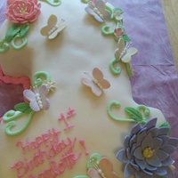 I Made This Number One Cake For My Neices First Birthday I Made The Flowers And Butterflies With Gumpaste And It Is Covered With Mmf It W I made this number one cake for my neice's first birthday. I made the flowers and butterflies with gumpaste and it is covered with mmf...