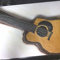 Acoustic Guitar Cake Made a half sheet cake and cut it down to the shape I needed. All details are buttercream, finished with airbrushing.